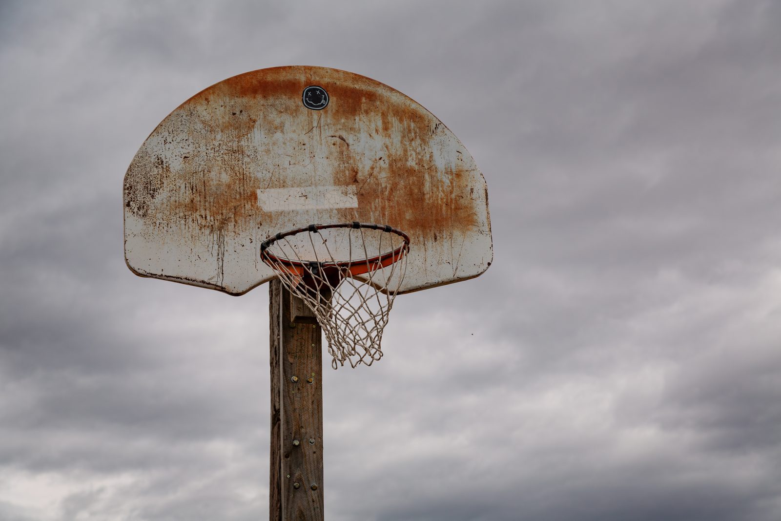 A basketball hoop at a playground court