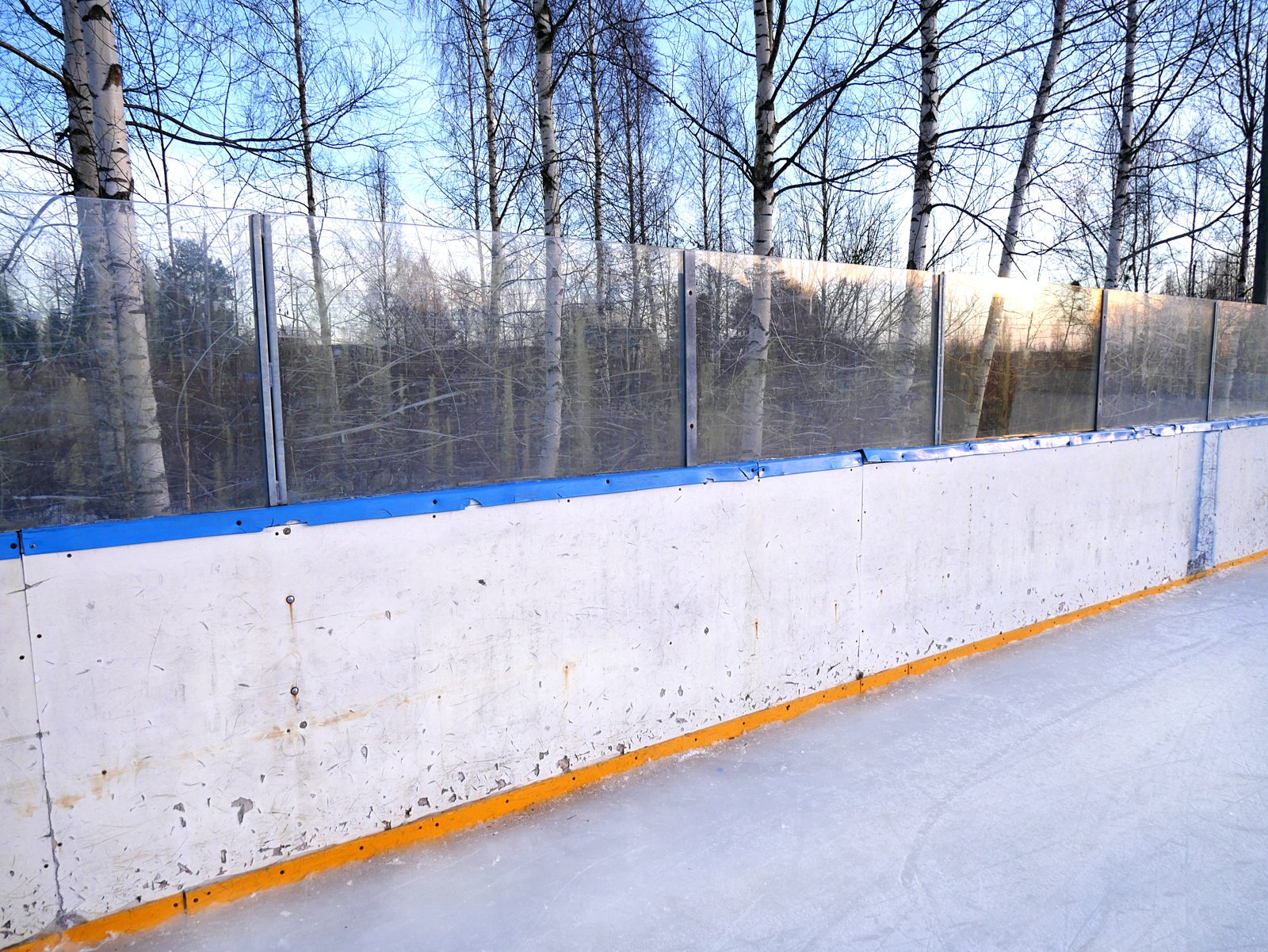 The boards around an ice hockey rink