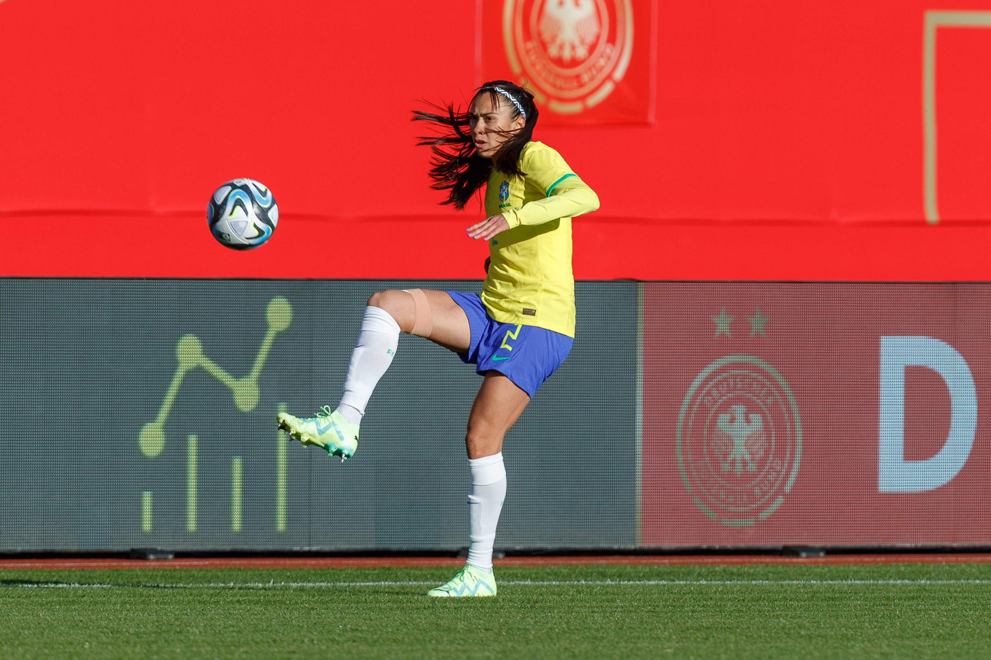 Women's international football match in a stadium