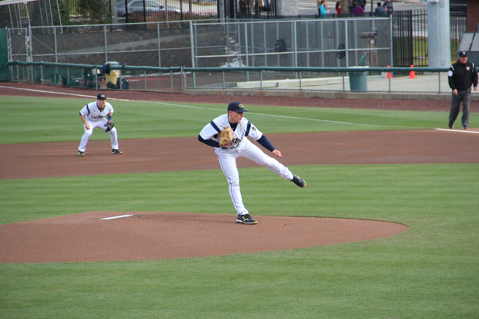 A pitcher throws from the mound during a baseball game