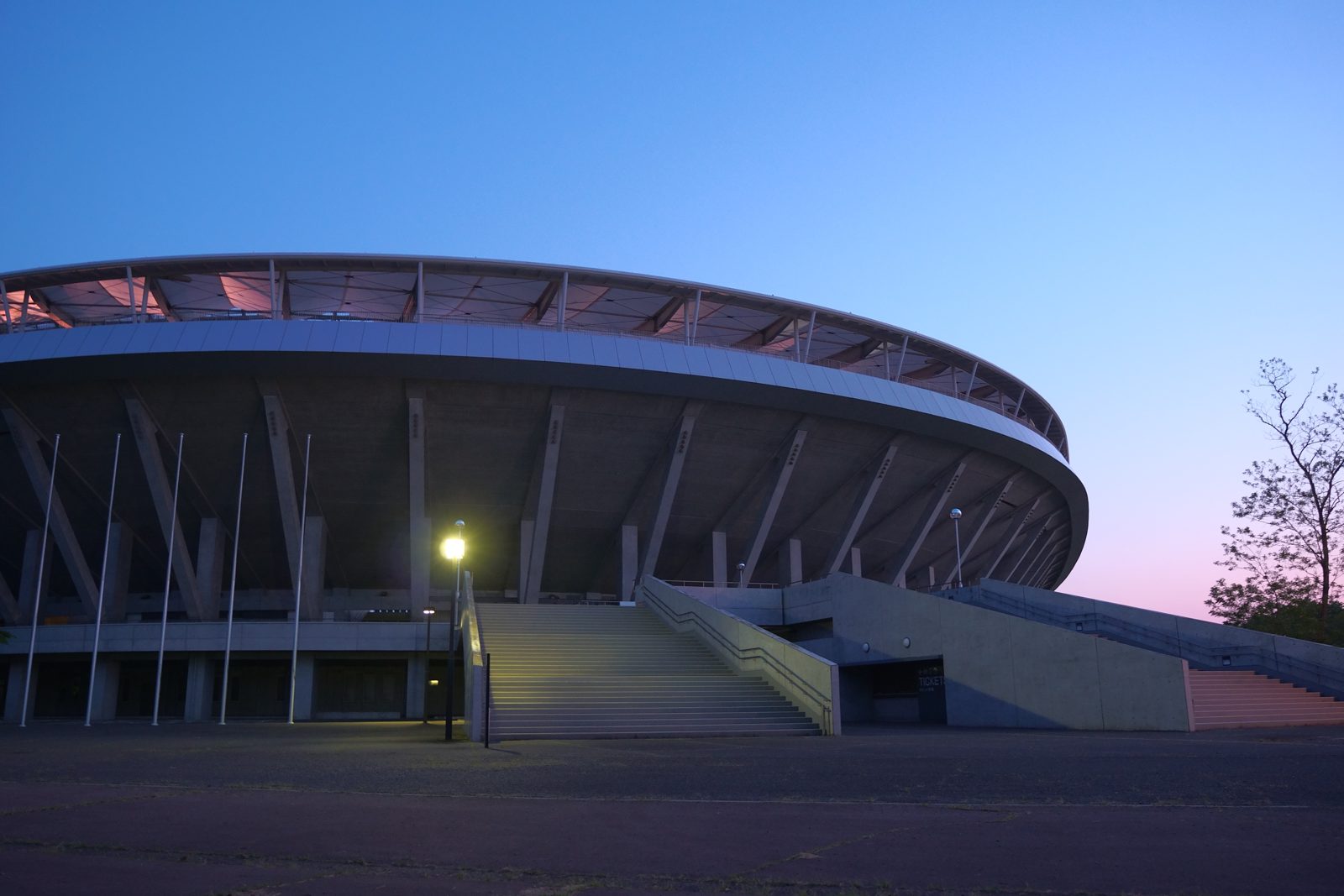 A baseball stadium under evening lights