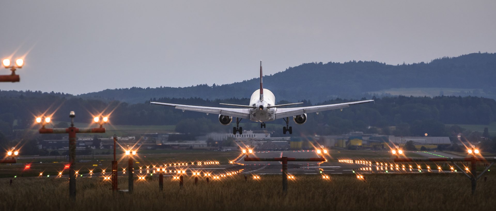 A plane lands at an airport