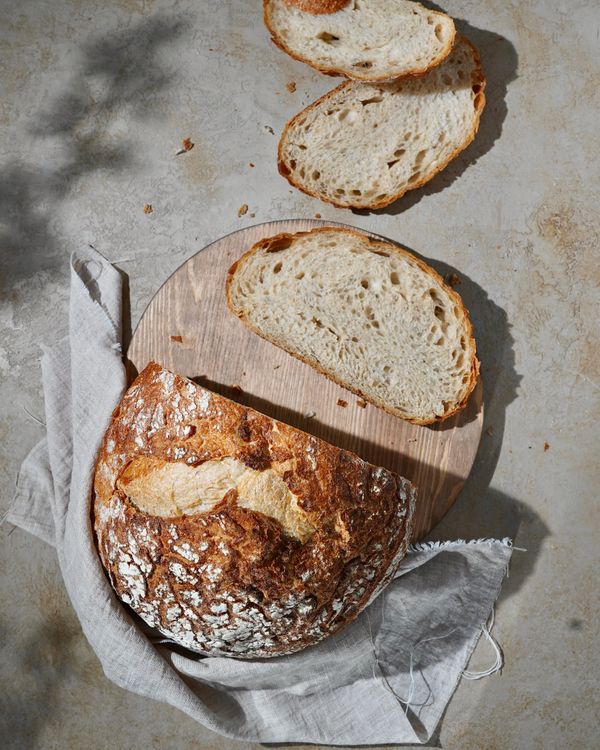 Sourdough bread with slices on a wooden board