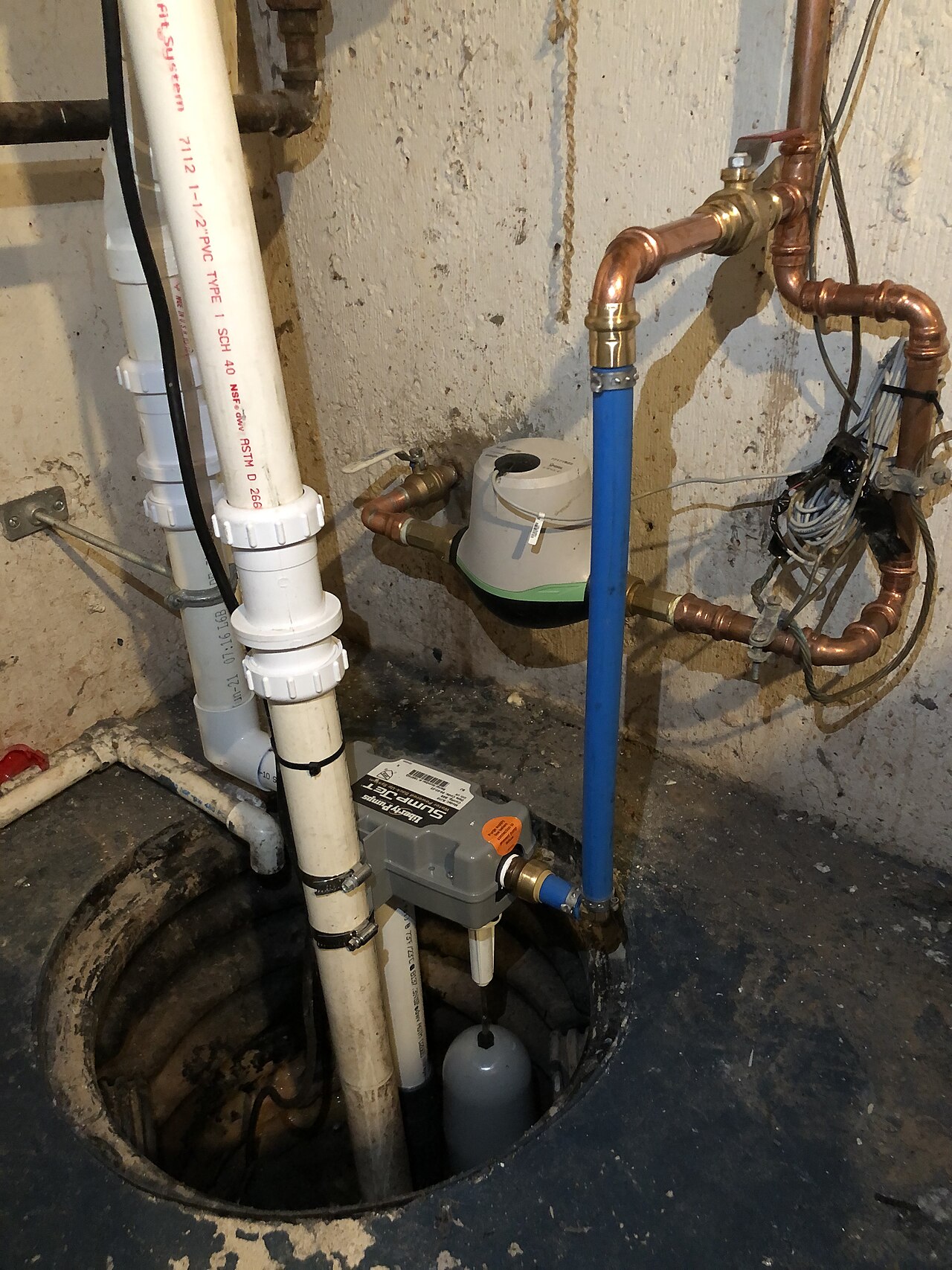 A newly installed sump pump in a home basement