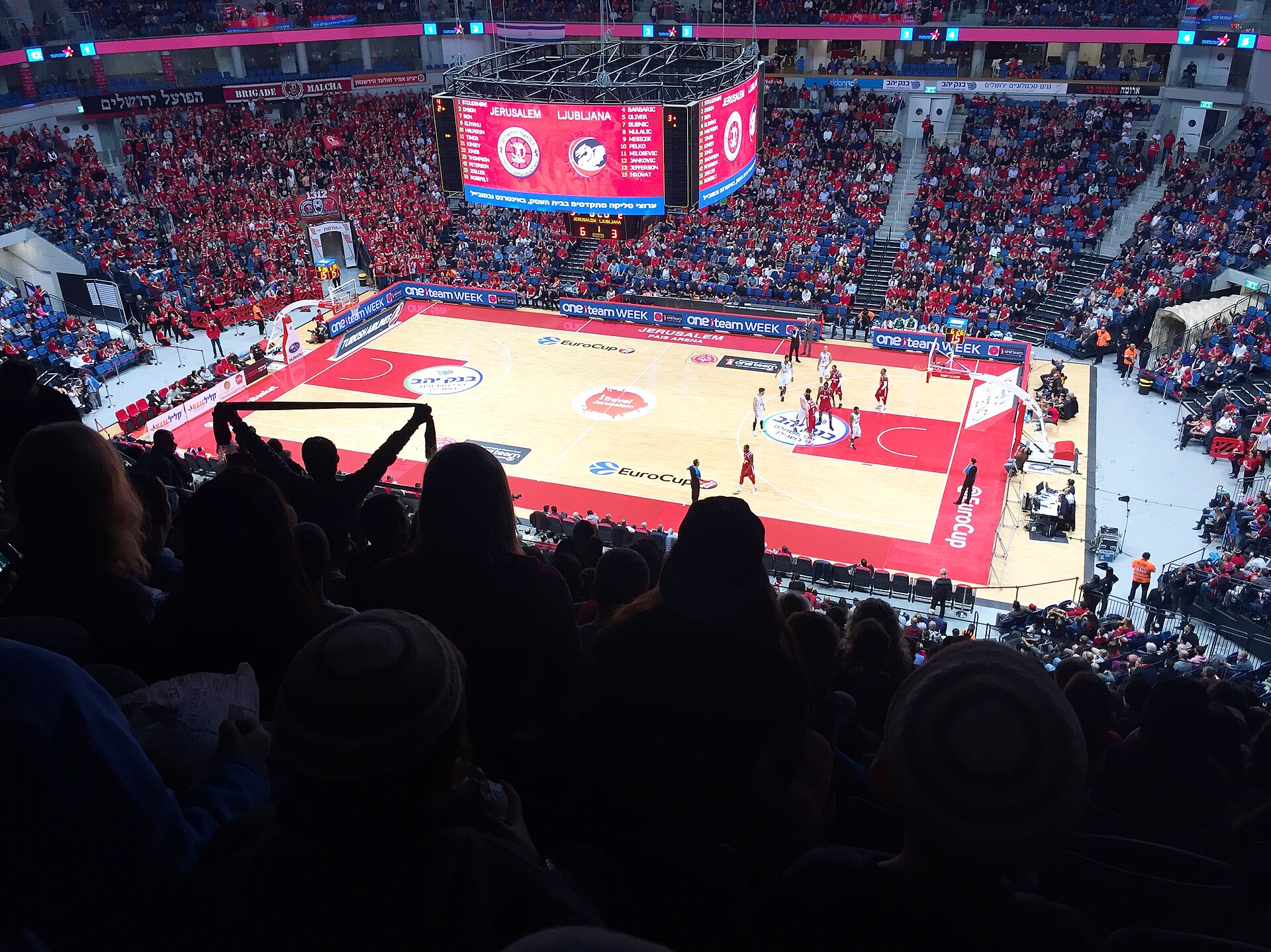 A basketball game in progress at an arena