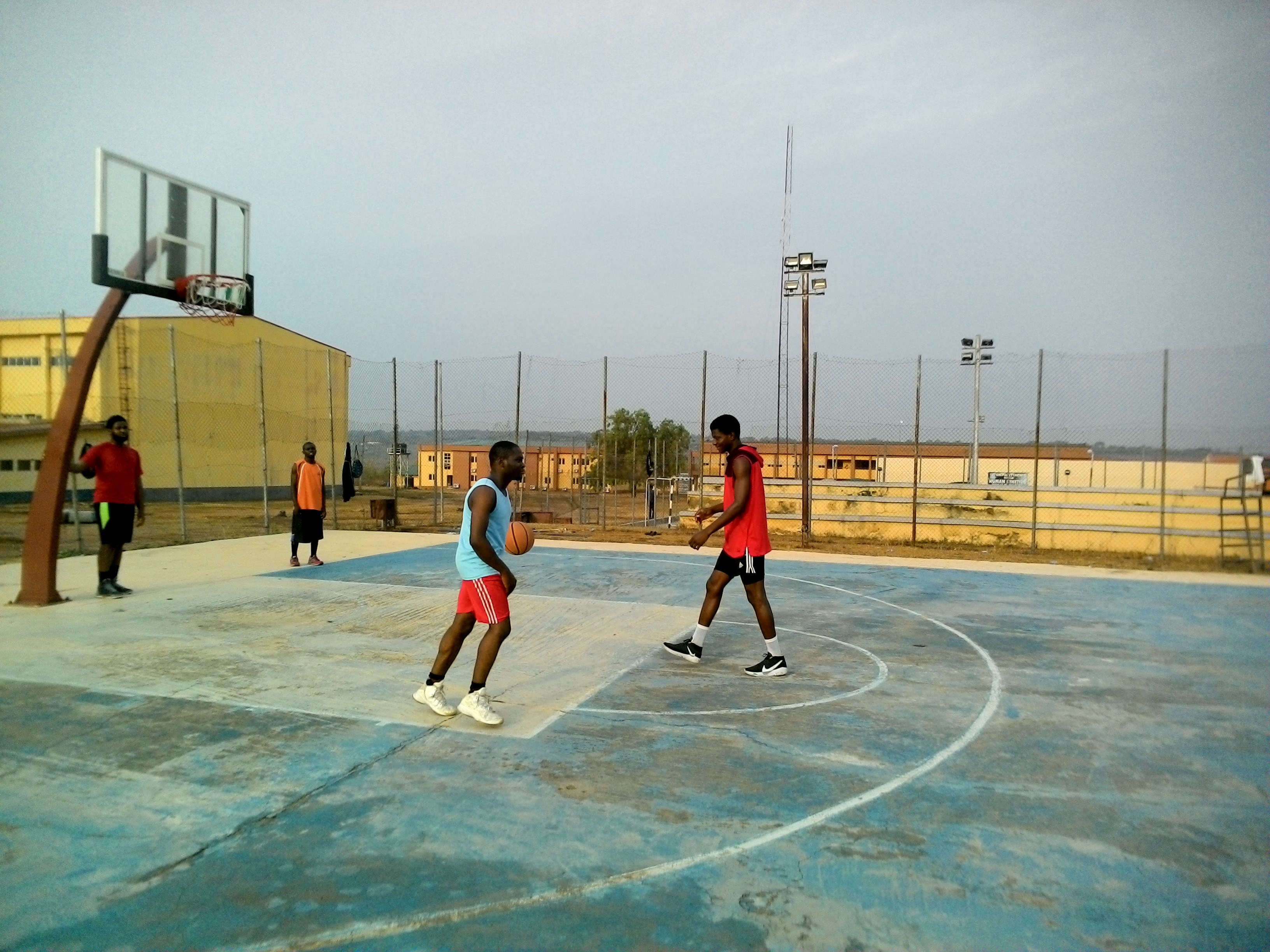 Basketball players run drills during a practice session