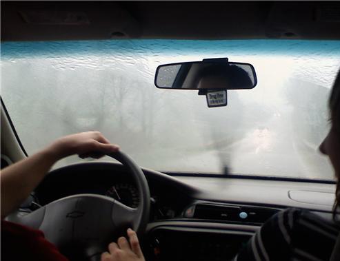 Rain on a car windscreen with wipers on