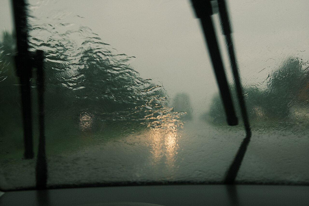 Windshield wipers clearing heavy rain