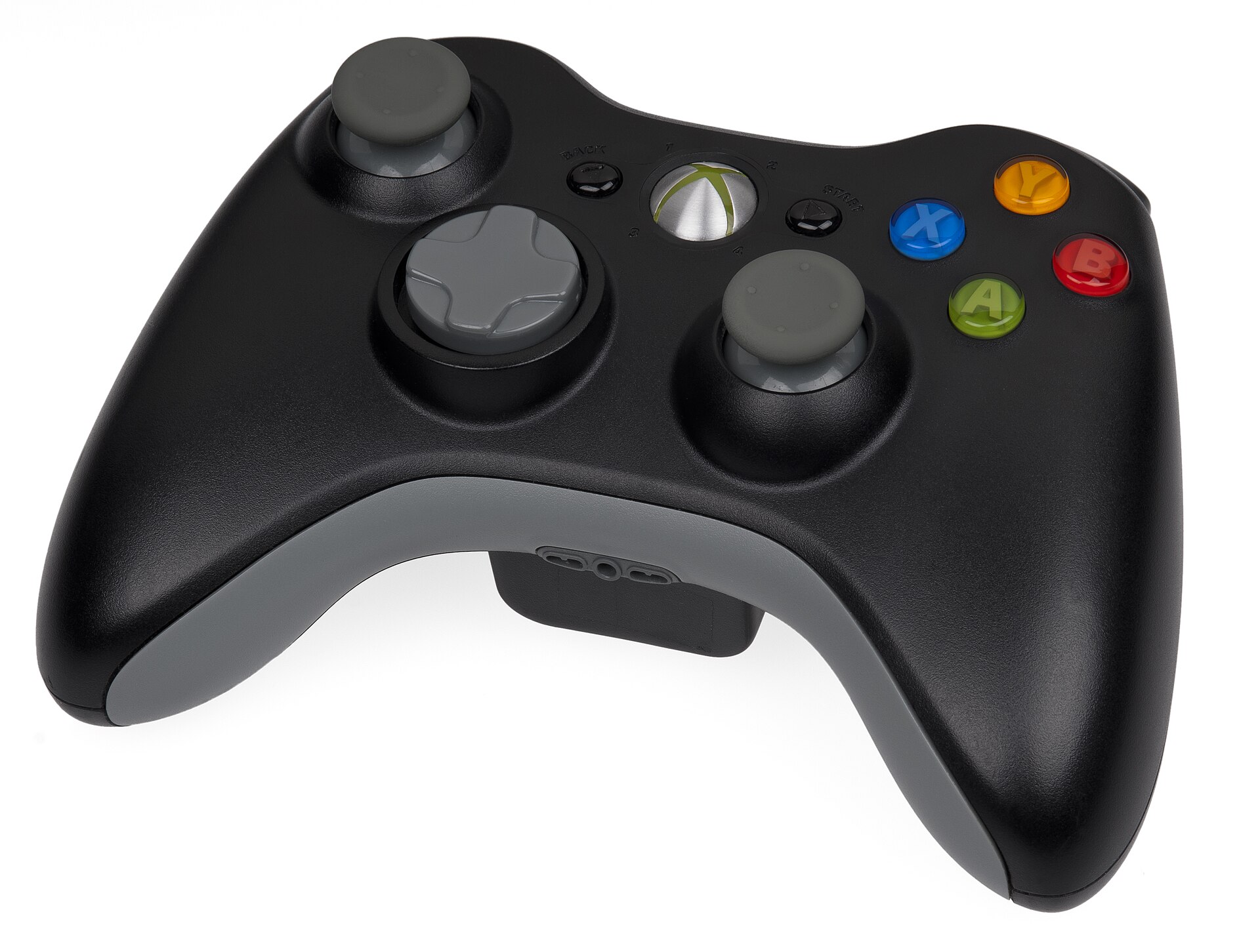 A black Xbox game controller on a white background