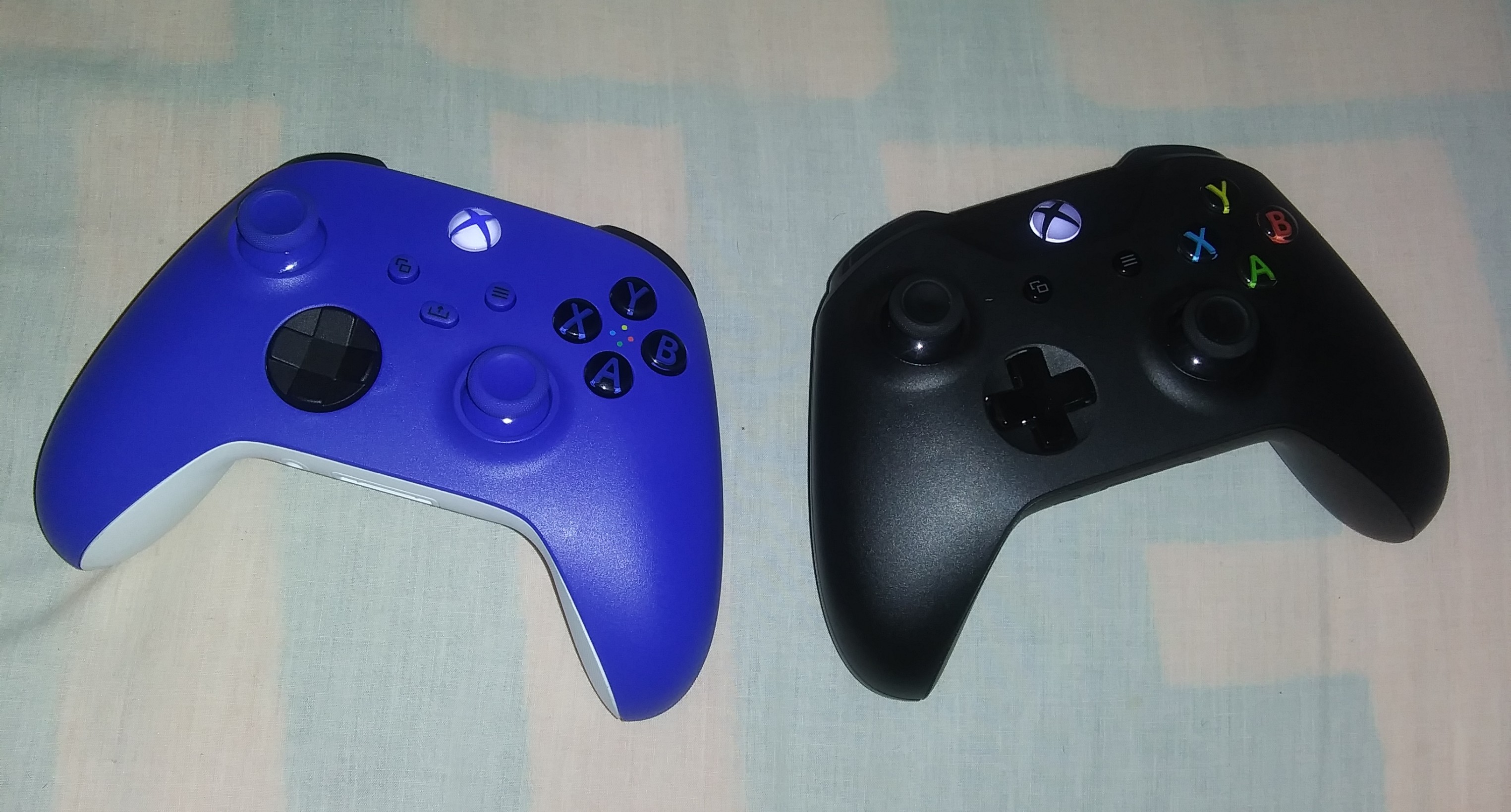 Two Xbox wireless controllers side by side
