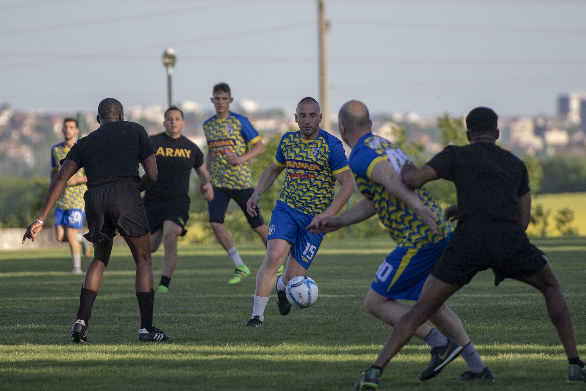 Players fight for the ball during a soccer match