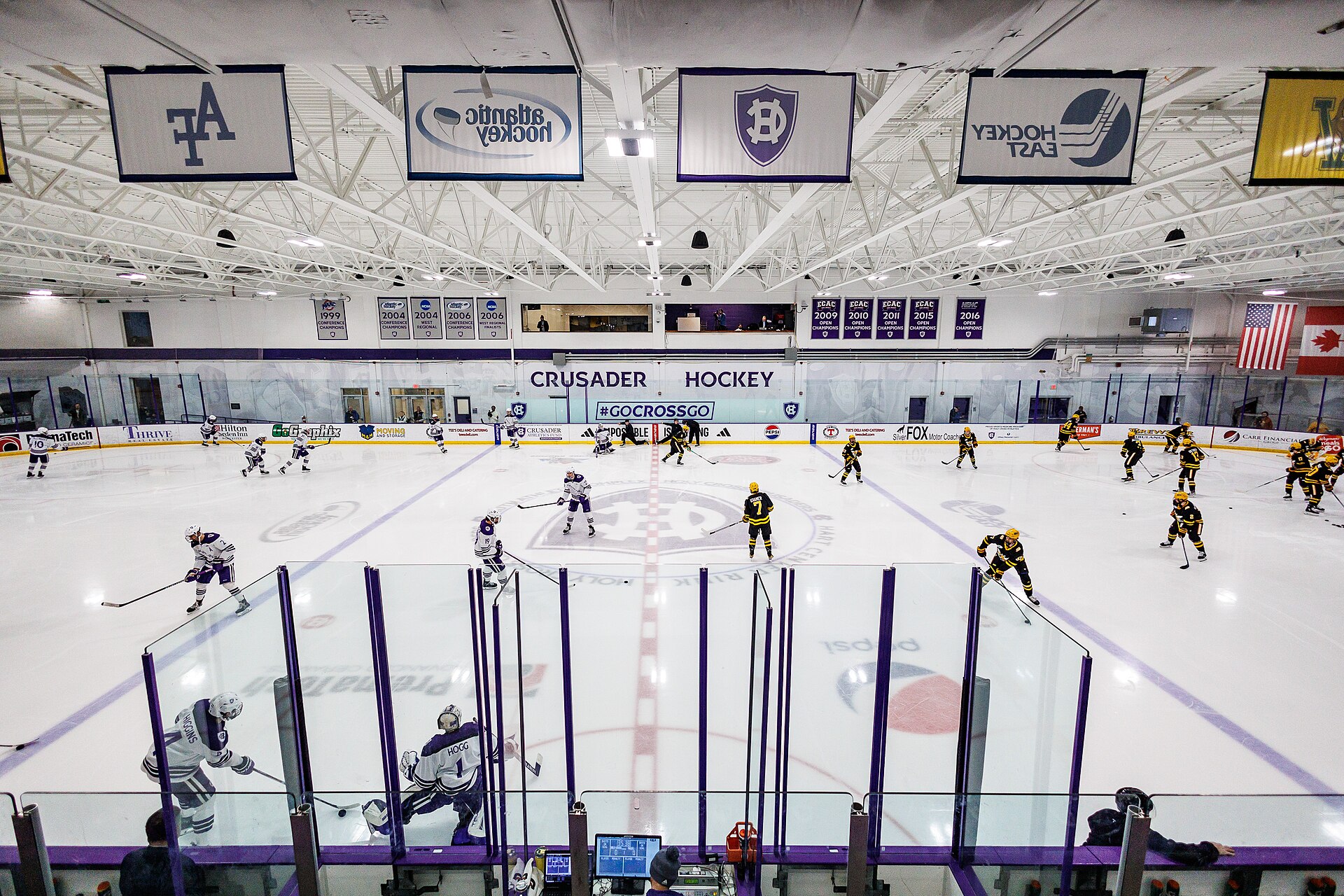 An empty ice hockey rink with clean ice and boards
