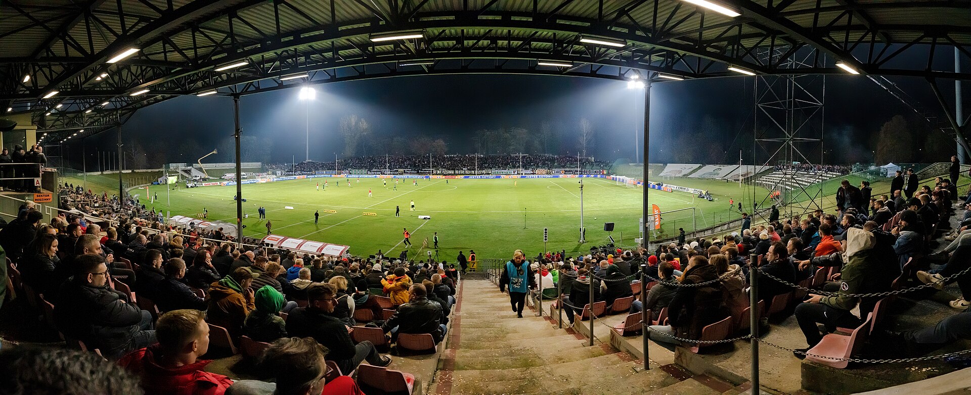 A soccer stadium during a match under the lights