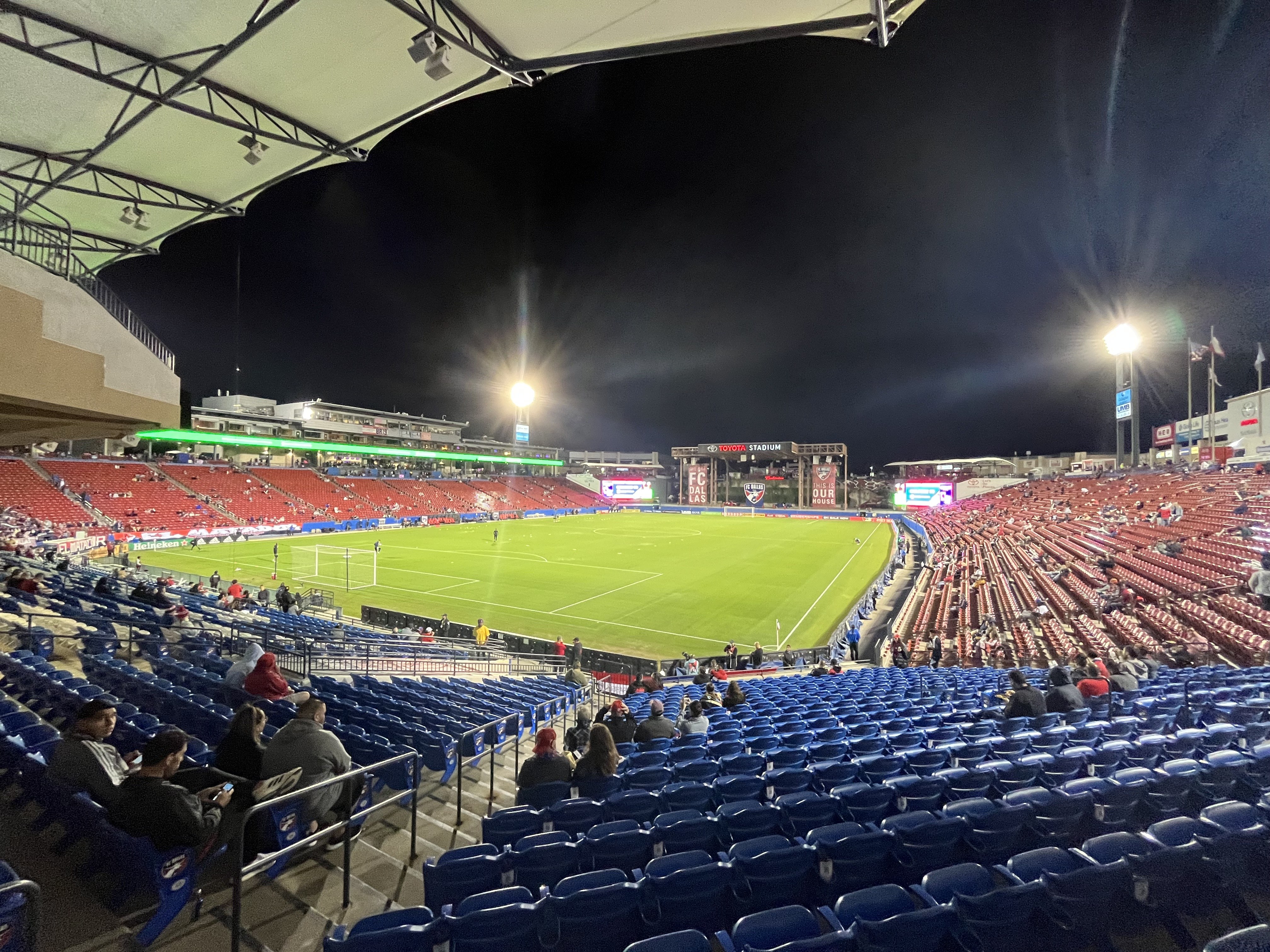 A soccer stadium lit up for a night game