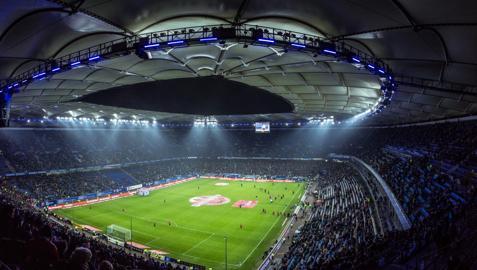 A soccer stadium lit up at night