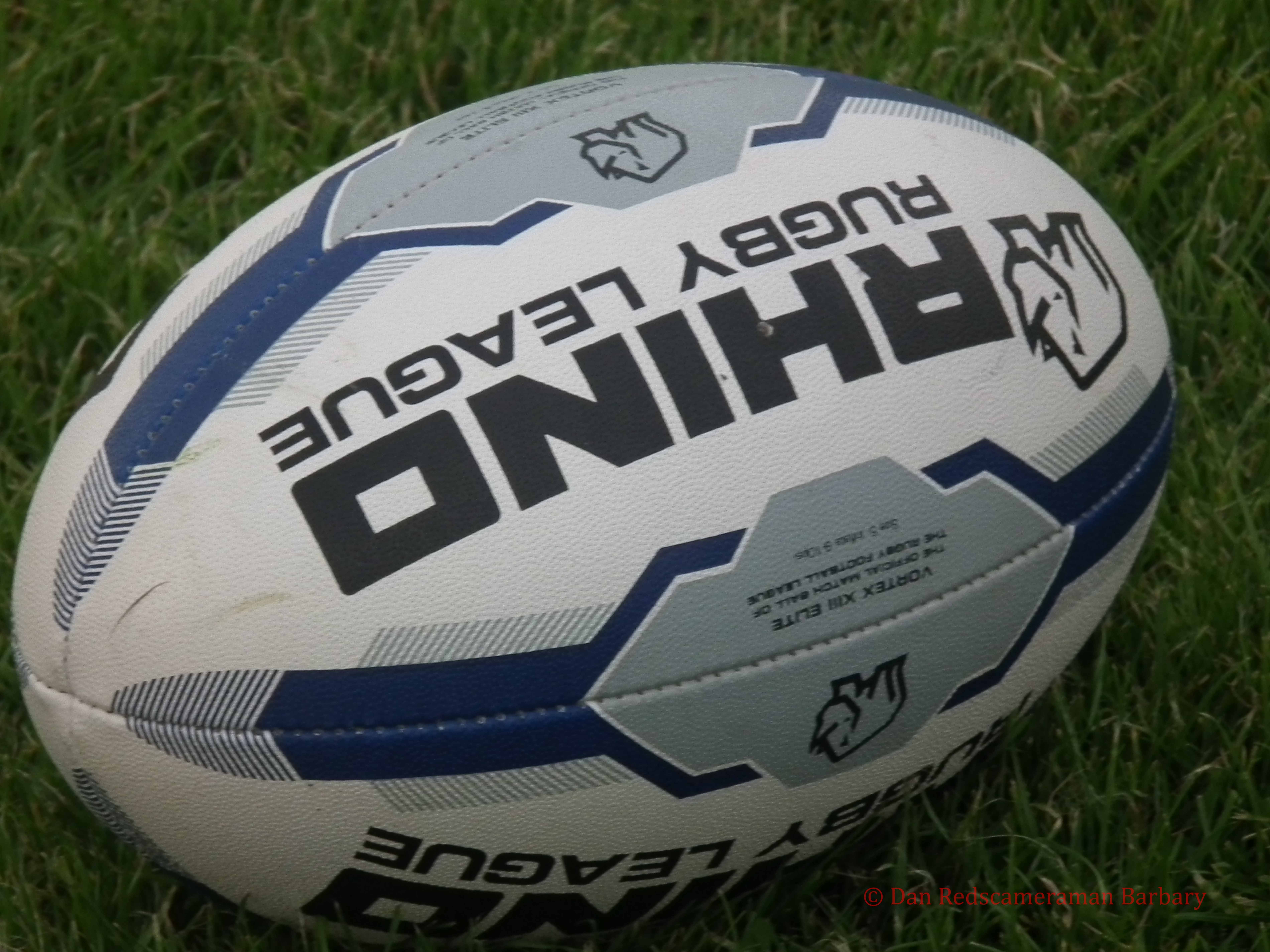 A rugby league ball on the field