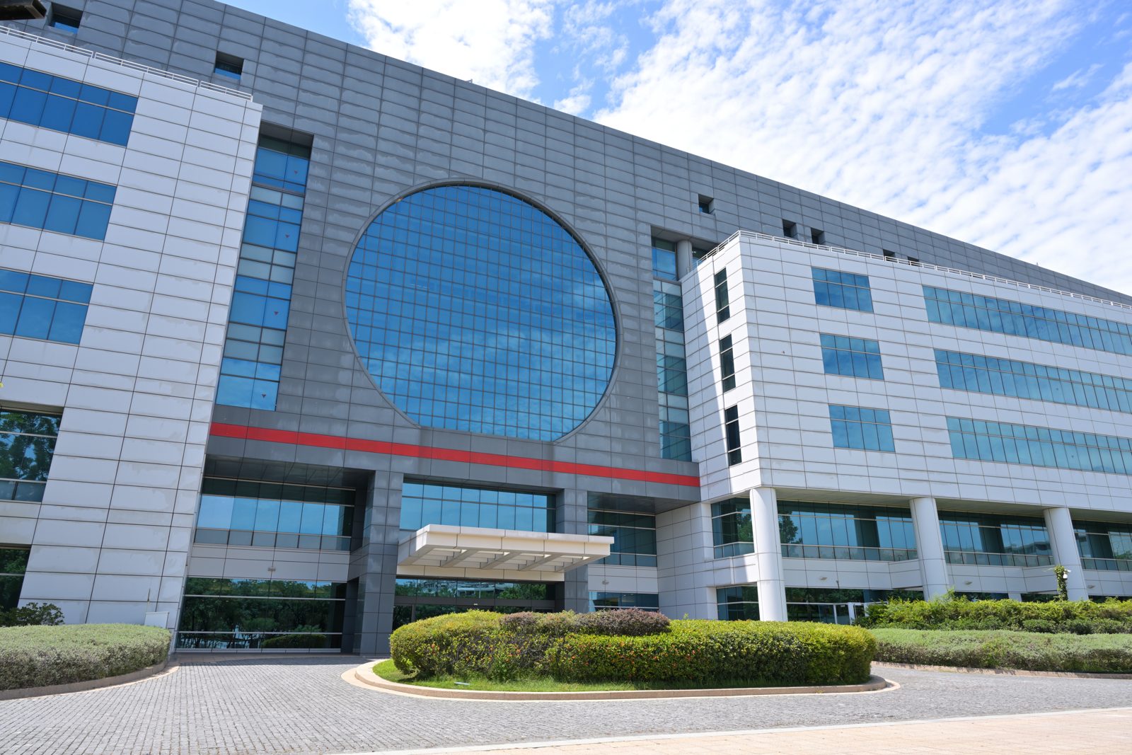 The front of TSMC Fab 6, a large chip factory building