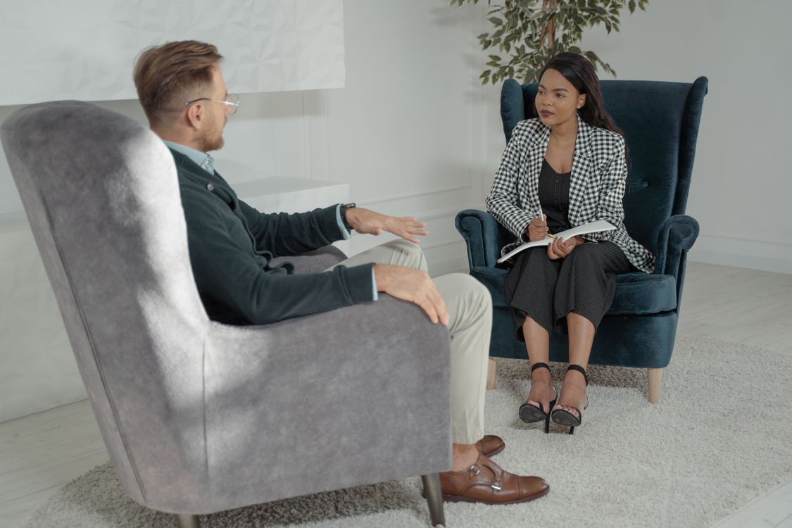 A man and a woman sitting for a one-on-one interview
