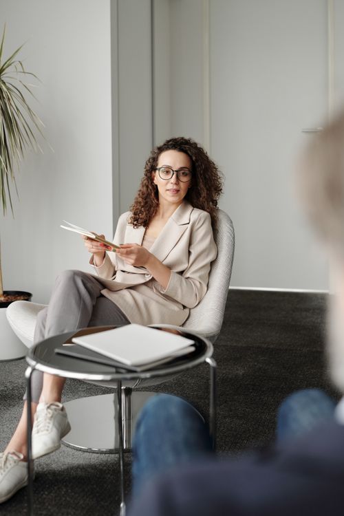 A professional woman in an office setting conducting an interview