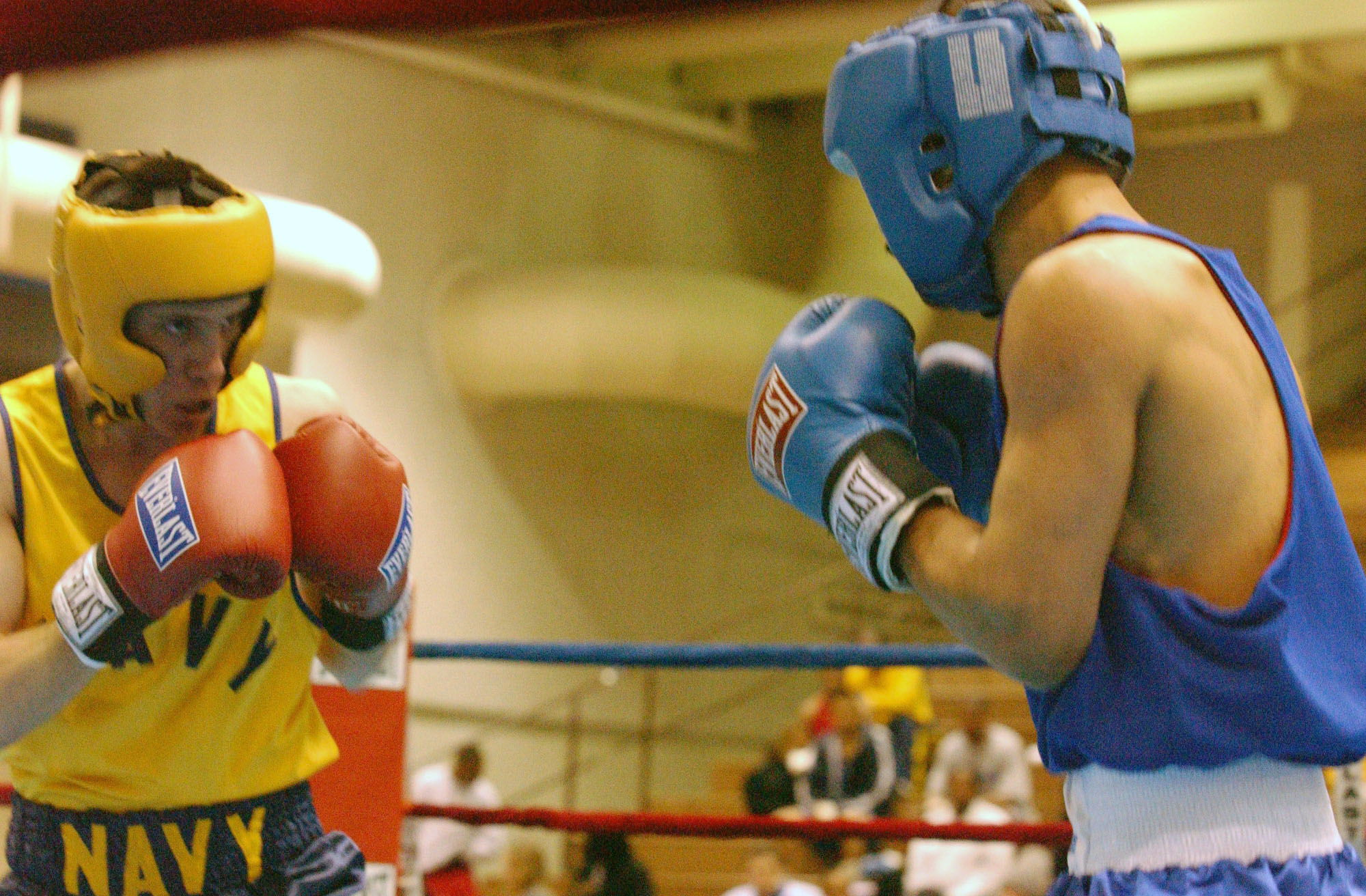 Two boxers face off in a ring