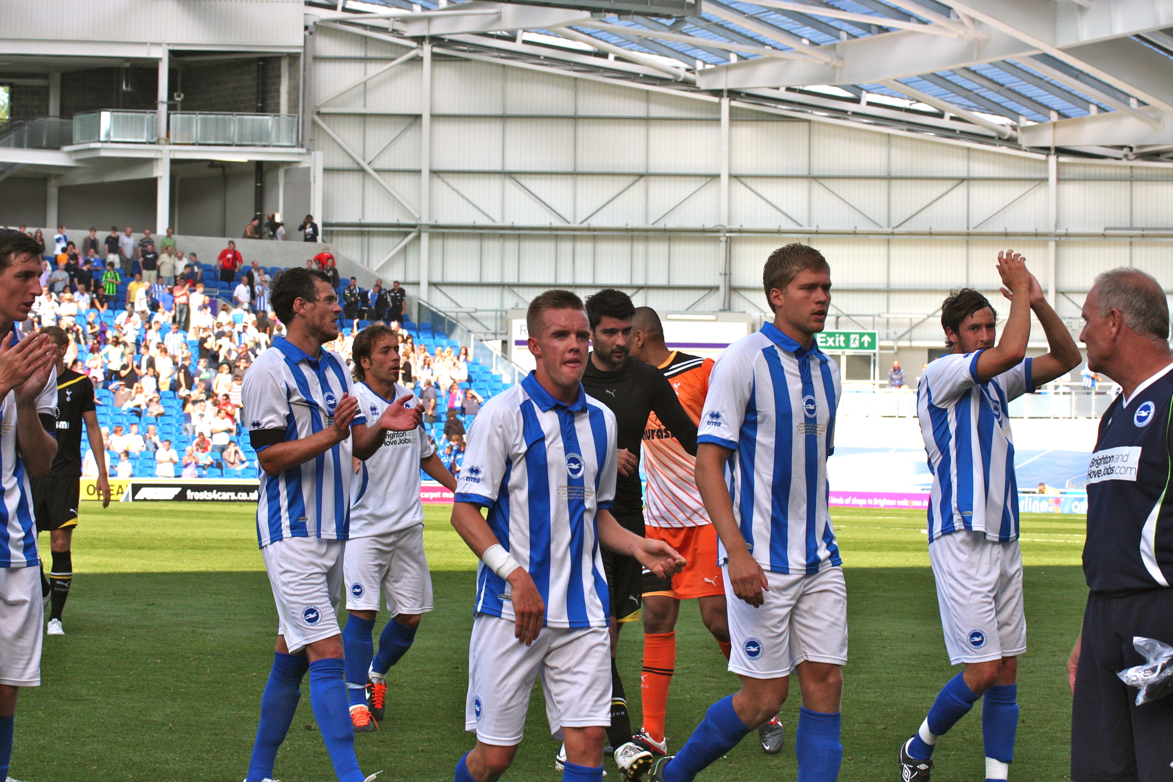 Brighton players celebrate a goal in an earlier home game