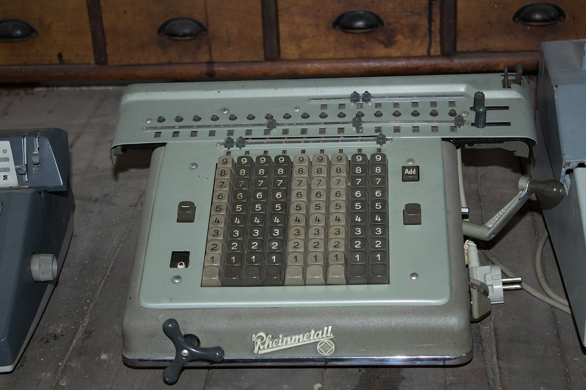 A vintage Rheinmetall mechanical calculating machine with rows of number keys