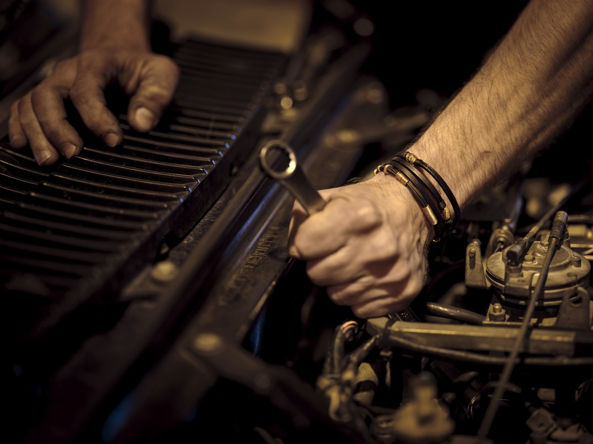 A mechanic working on a car in a workshop