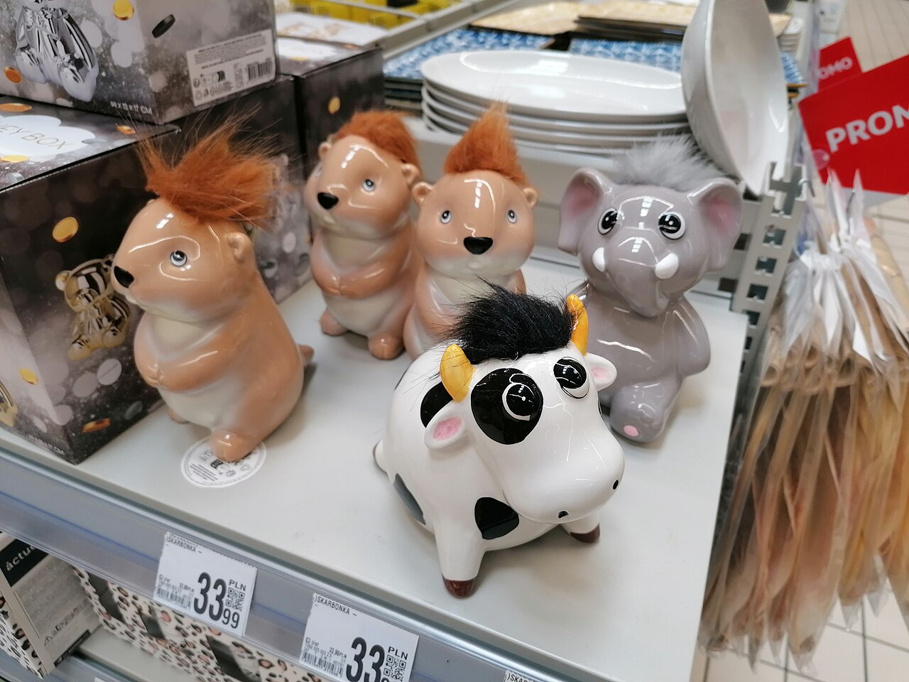 Ceramic piggy banks on a shelf