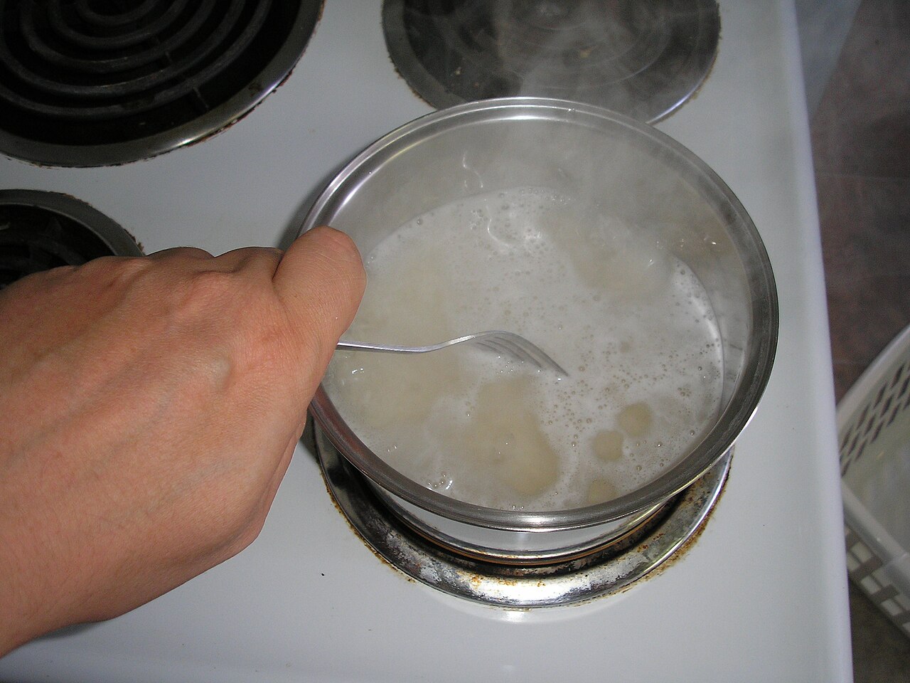 A pot of freshly cooked steamed rice