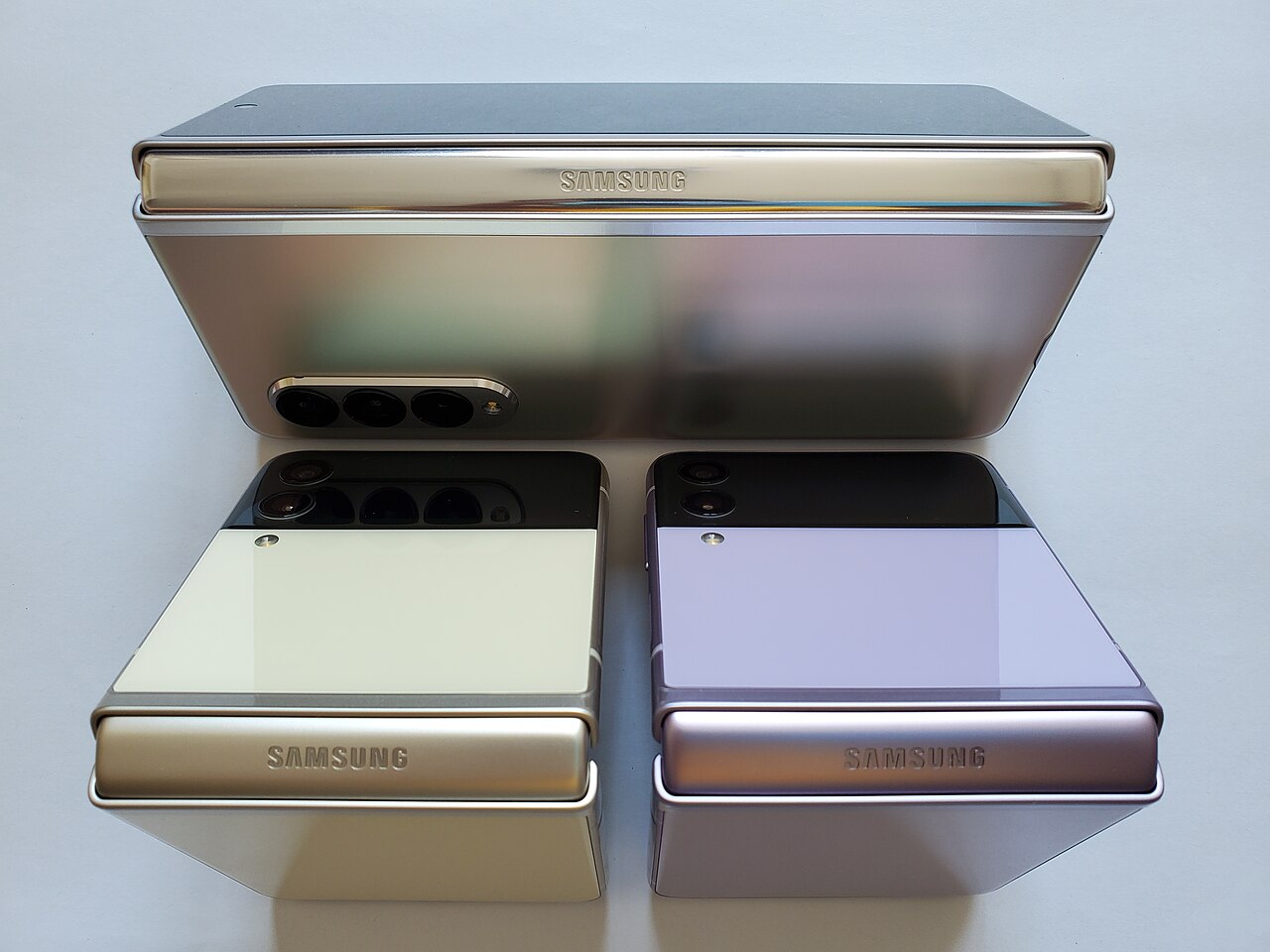 Foldable phones with a book-style fold, shown closed and open