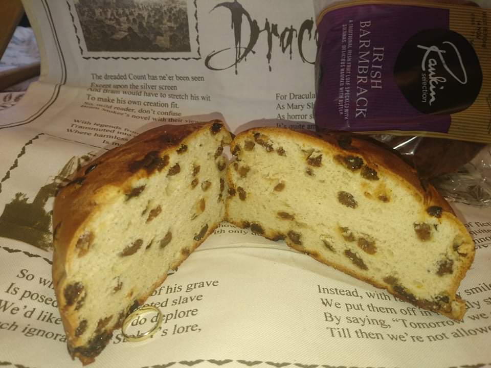 A loaf of browned sweet bread with a dark crust