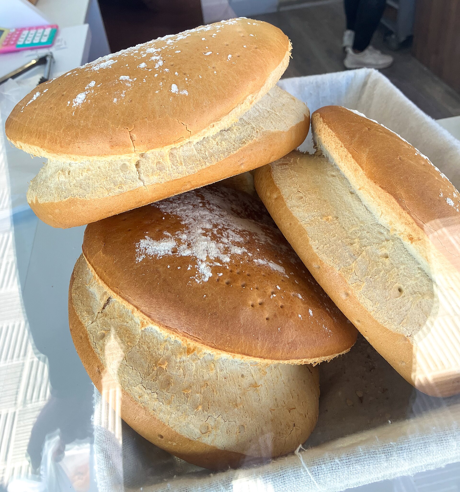 Round loaves of bread with browned crusts