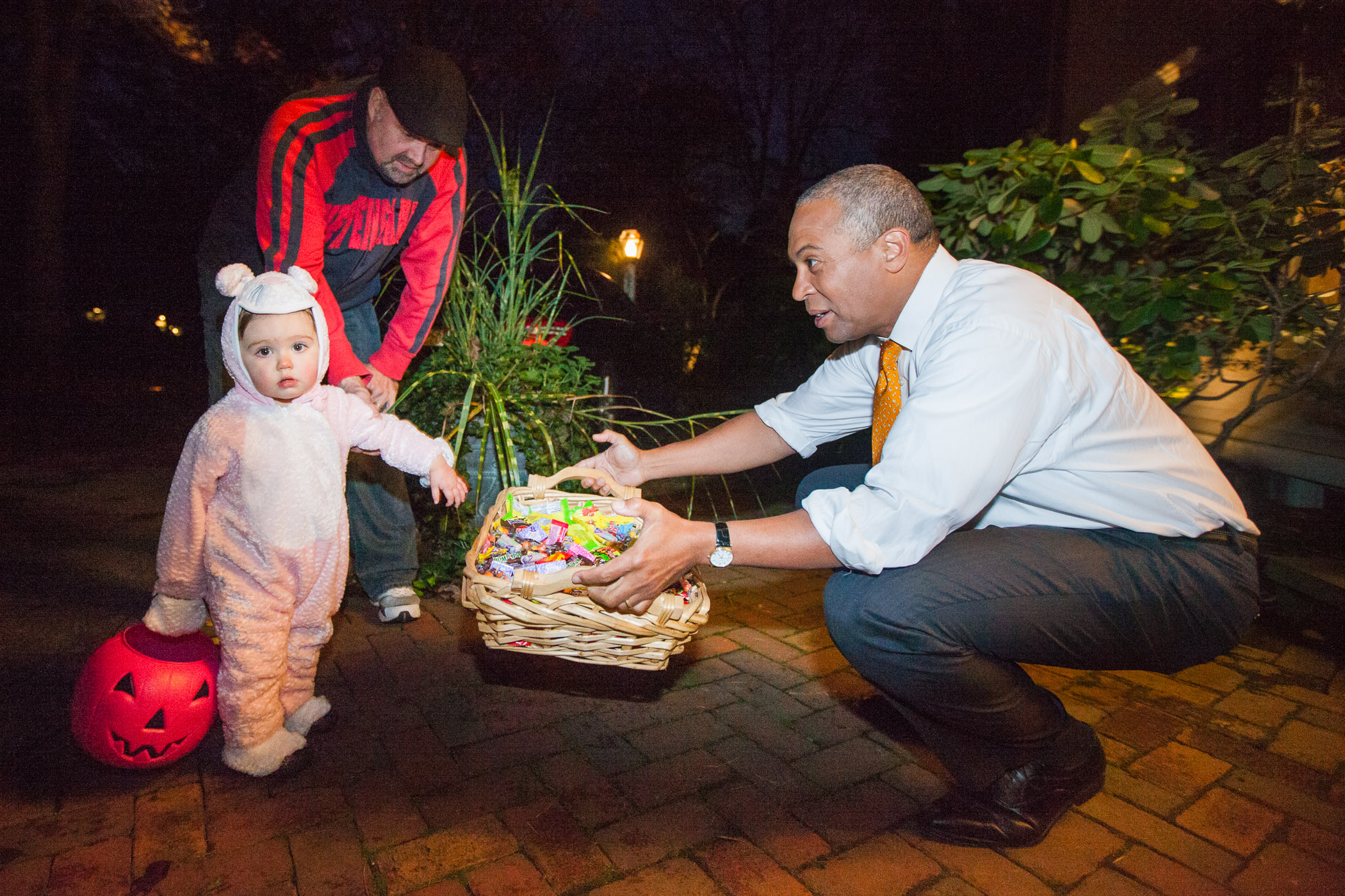 Children in costumes go trick-or-treating on Halloween