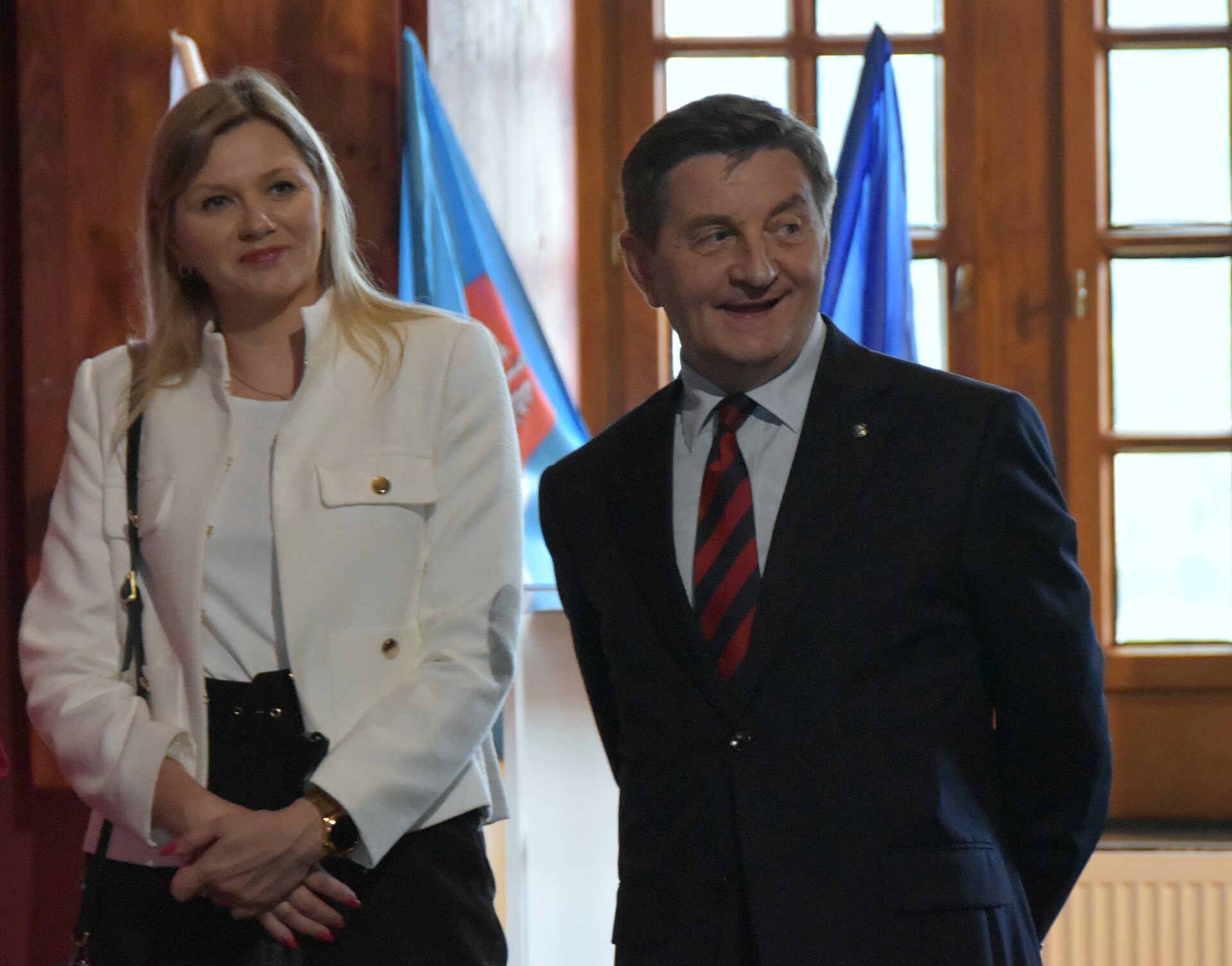 Two people signing a contract