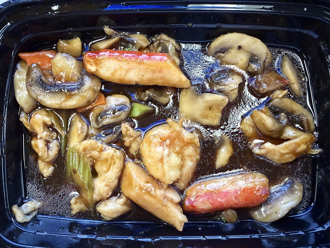 2026-03-21 17 40 56 A partially eaten "Happy Family" (sliced chicken, beef, roast pork, imitation crab meat, lobster meat and shrimp sauteed with mixed vegetables in delicious brown sauce) in Westampton, New Jersey