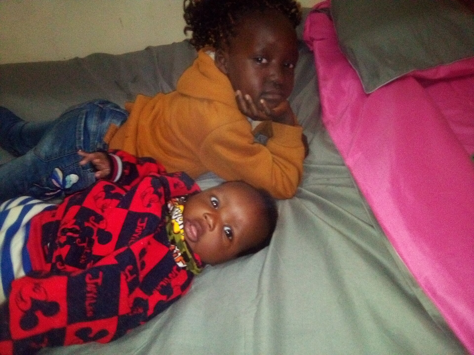 Two children sleeping peacefully in bed