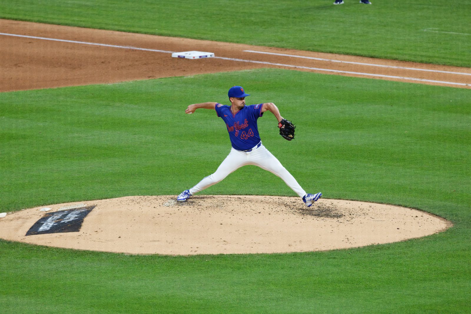 A pitcher delivers a pitch during a major league game