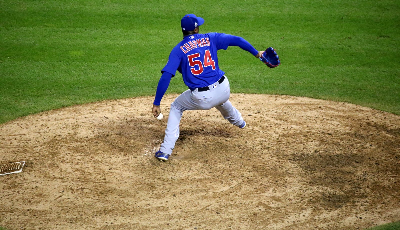 A pitcher throws a pitch in the eighth inning of a game