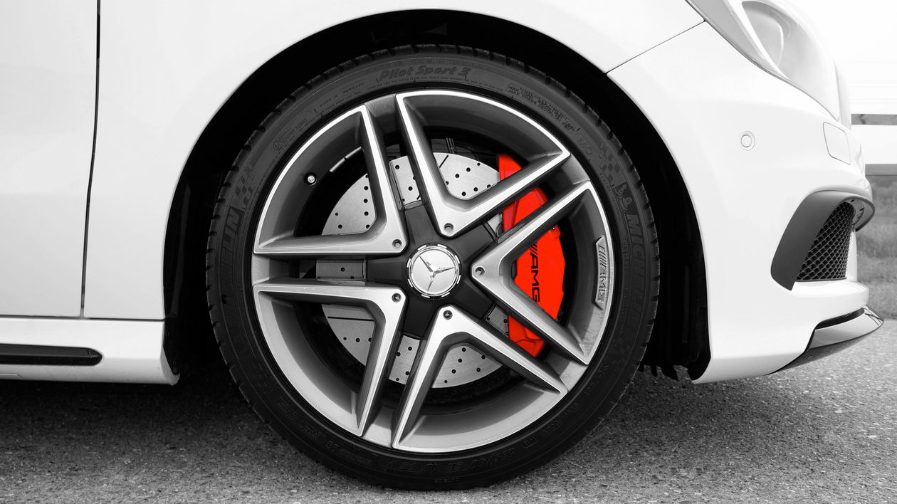 A Mercedes-Benz wheel with a red brake caliper