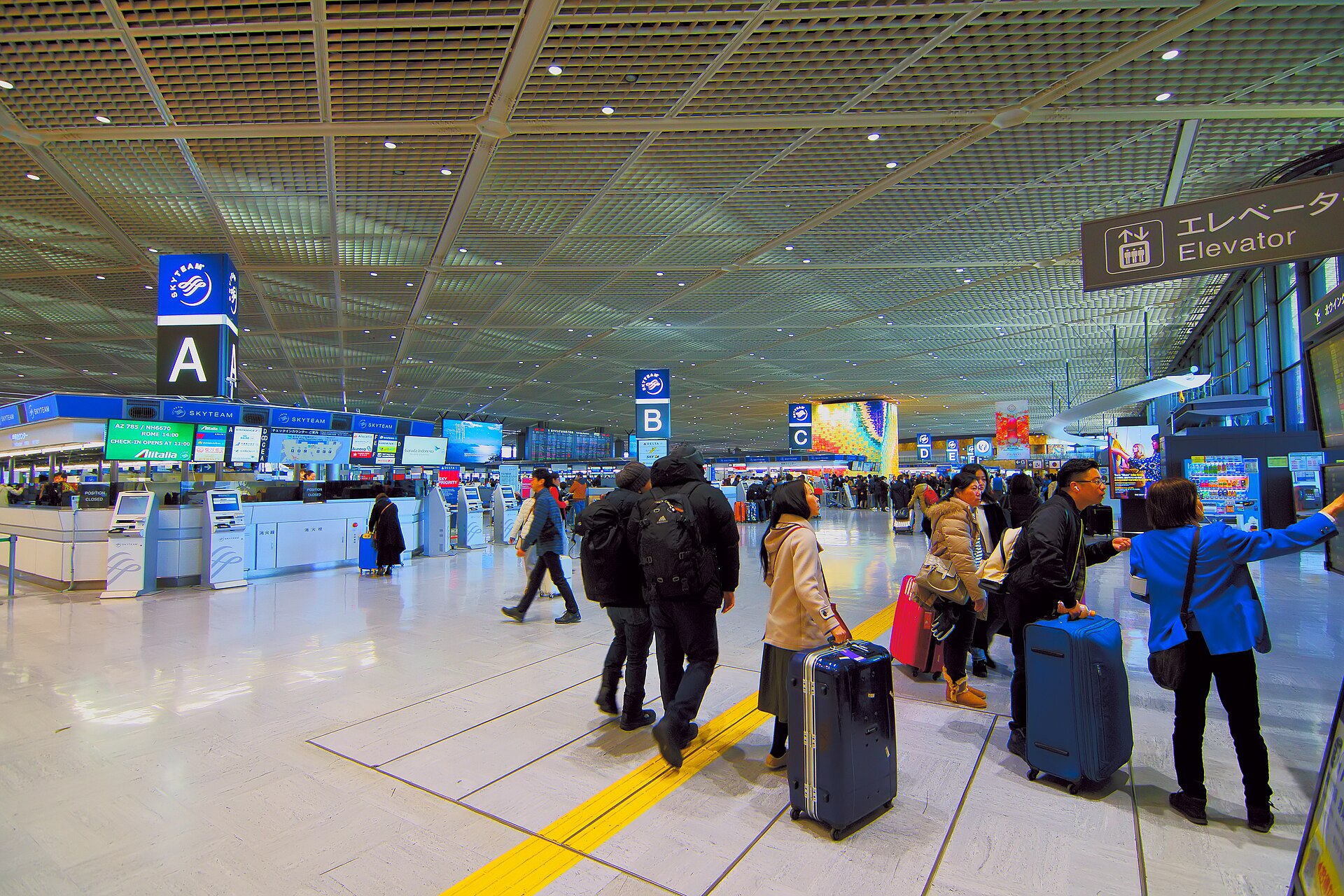 A busy departure lobby at an international airport terminal