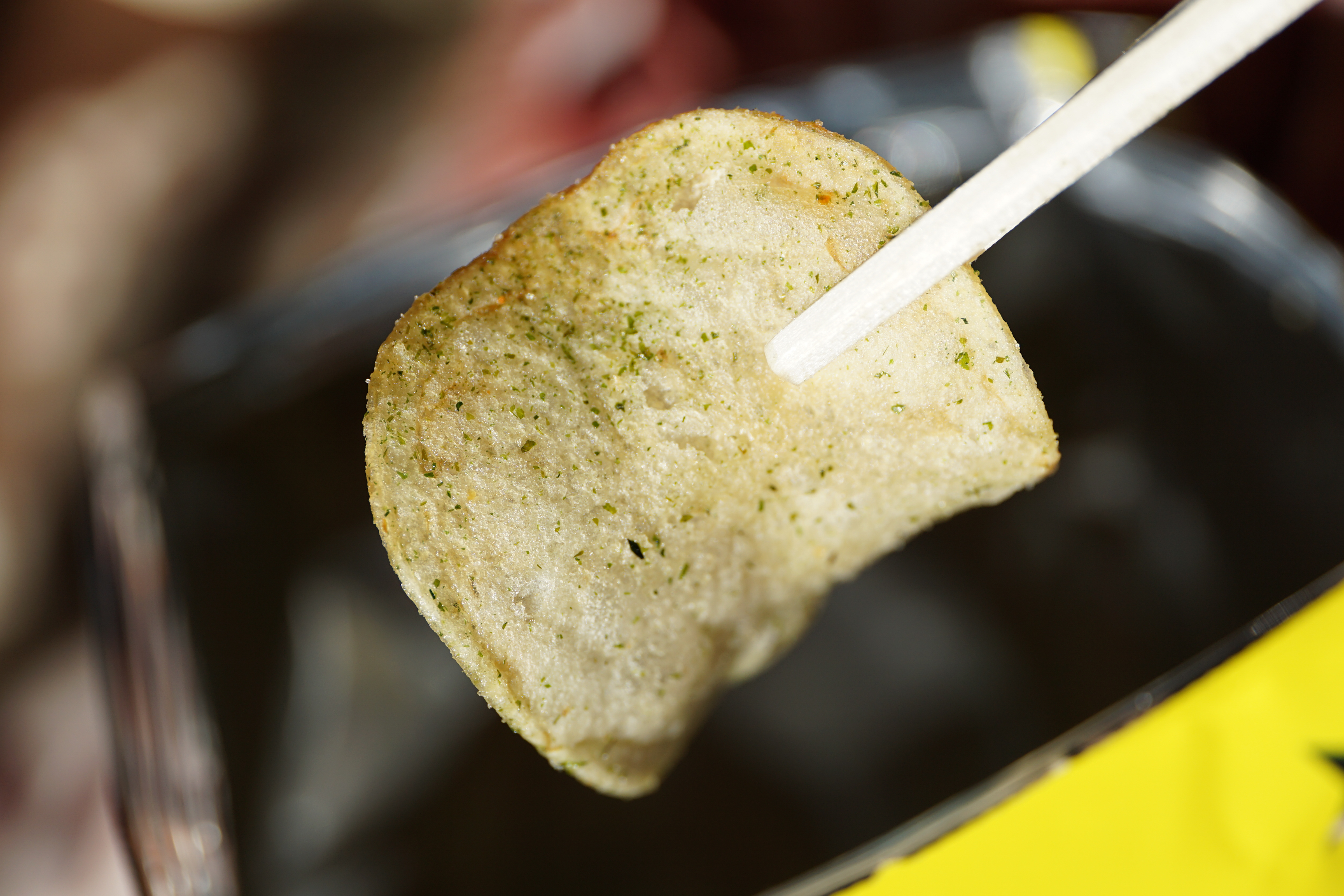 A bowl of potato chips, a classic ultra-processed snack