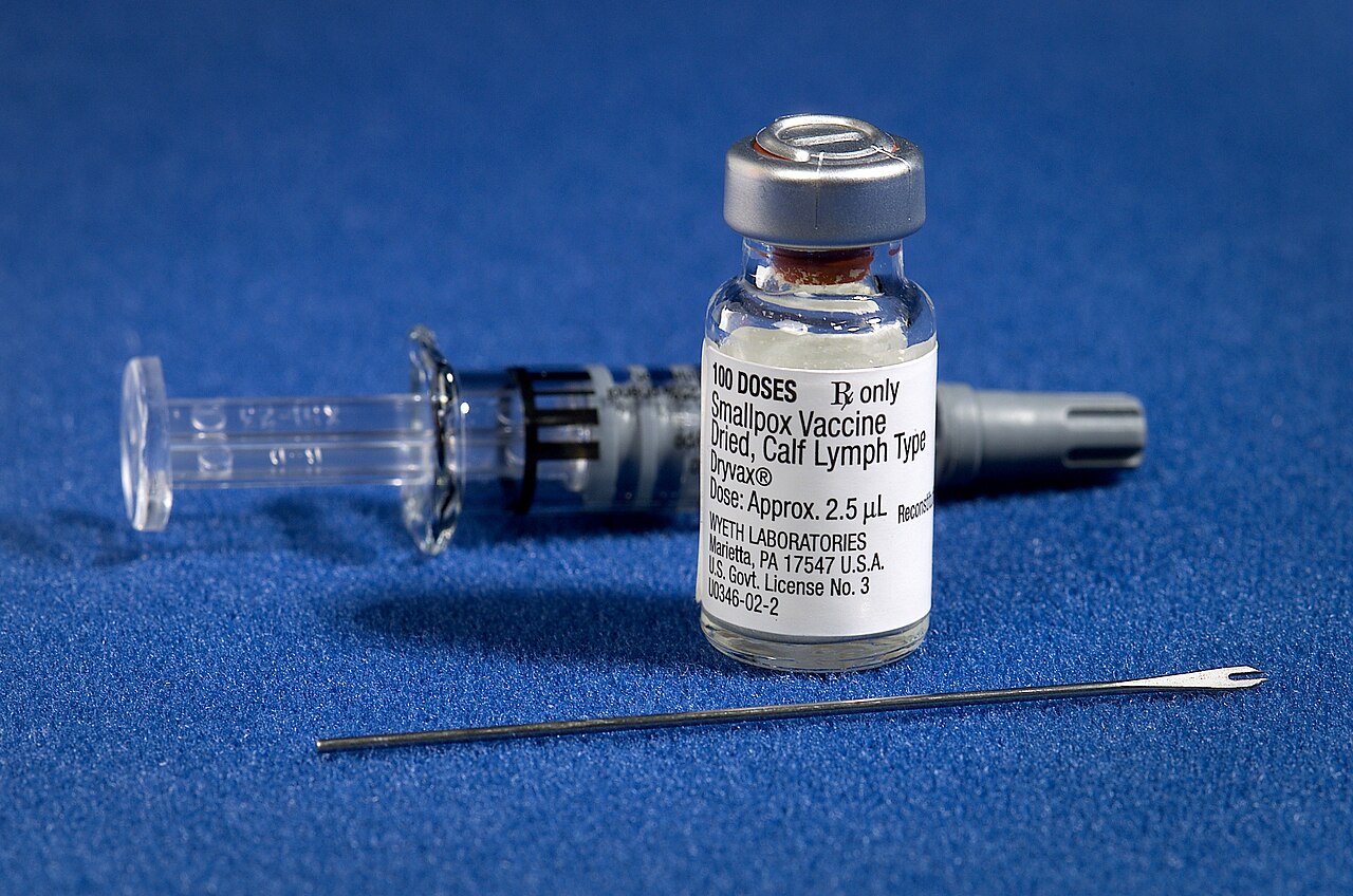 A smallpox vaccination kit with diluent, a vial of vaccine, and a bifurcated needle