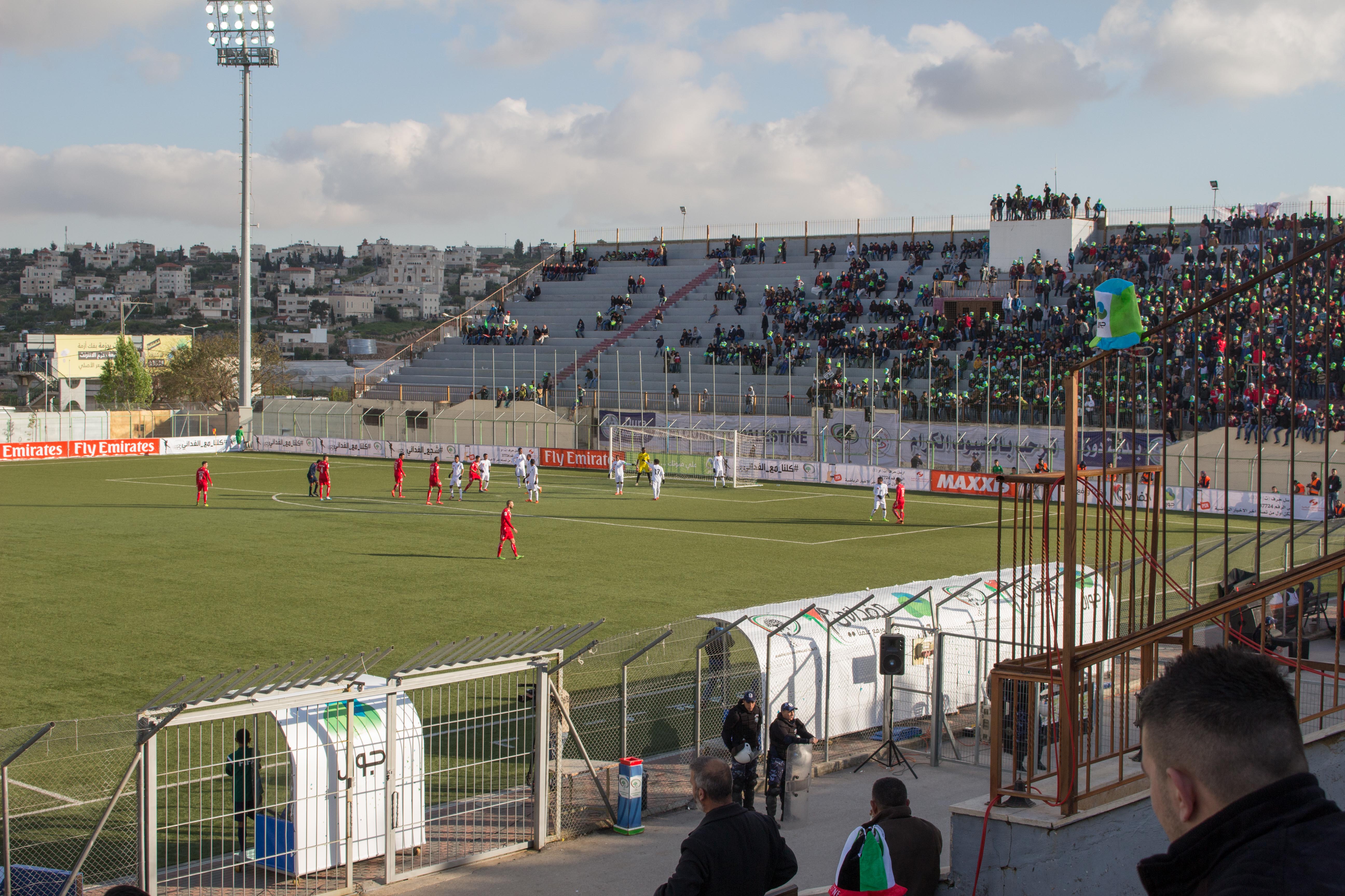 Fans in the stands at a football stadium