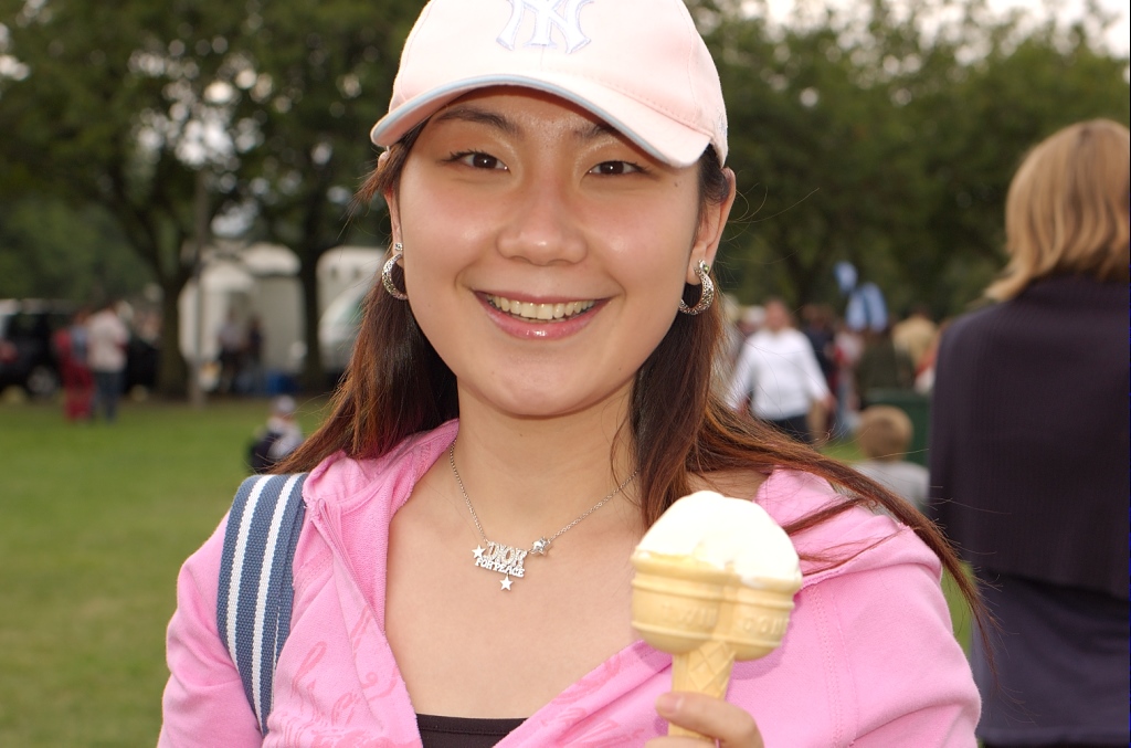A girl eating an ice cream cone outdoors