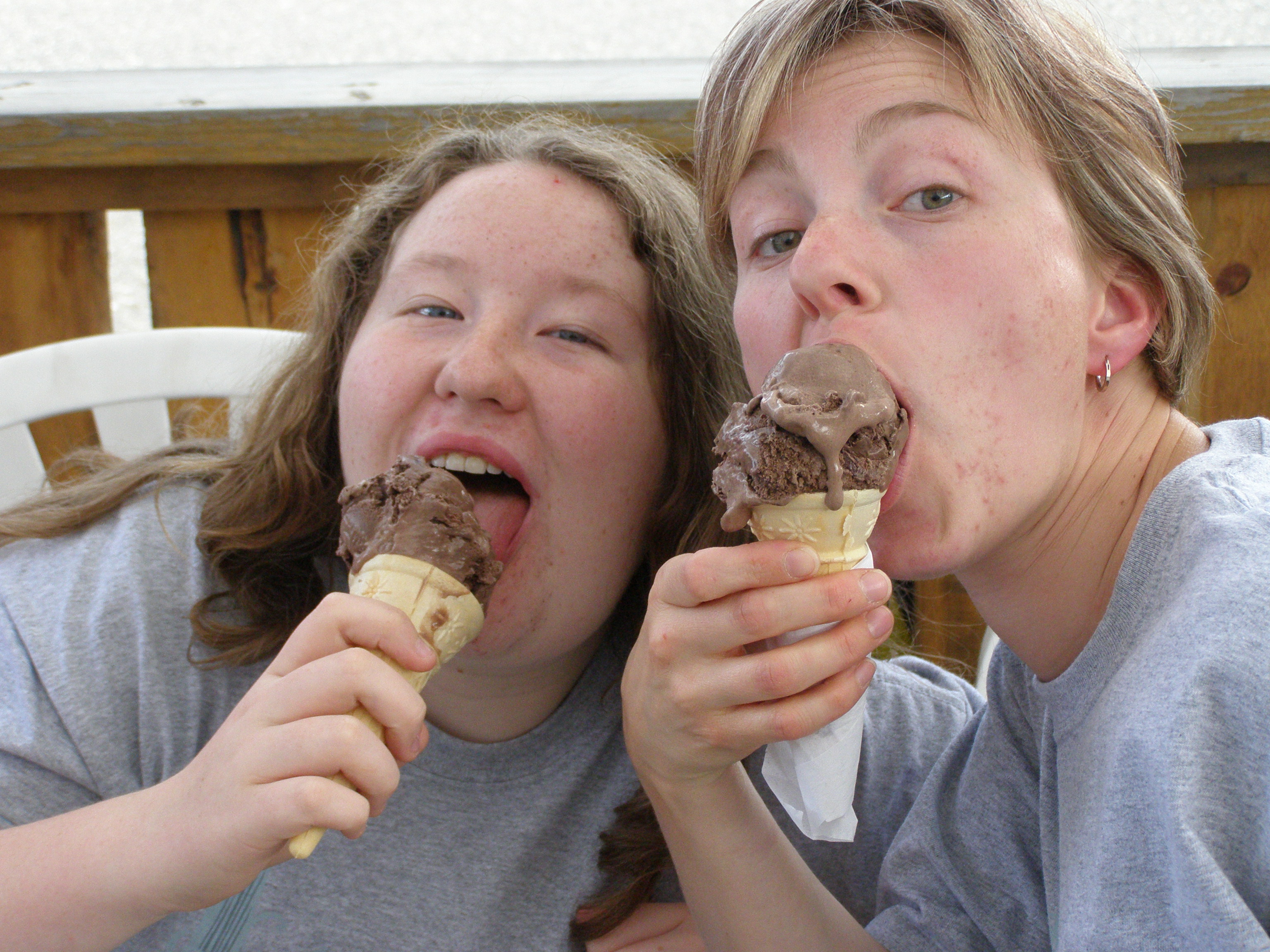 Chocolate ice cream cones eaten outdoors