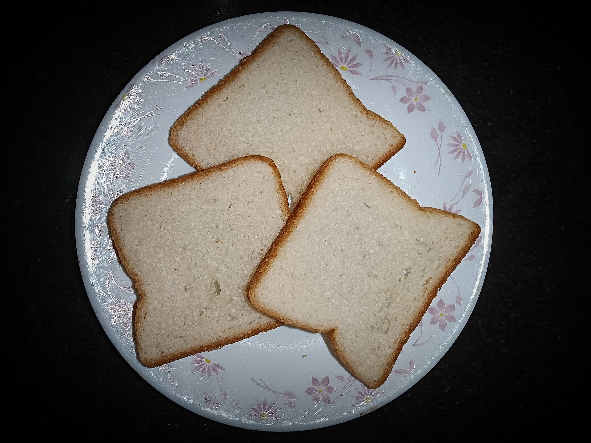 Three slices of white bread on a plate