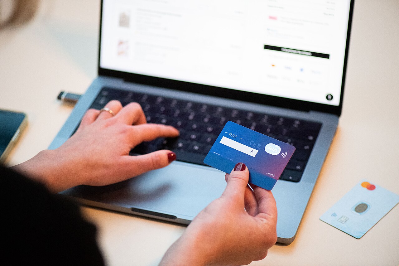 A shopper paying for an online purchase with a bank card