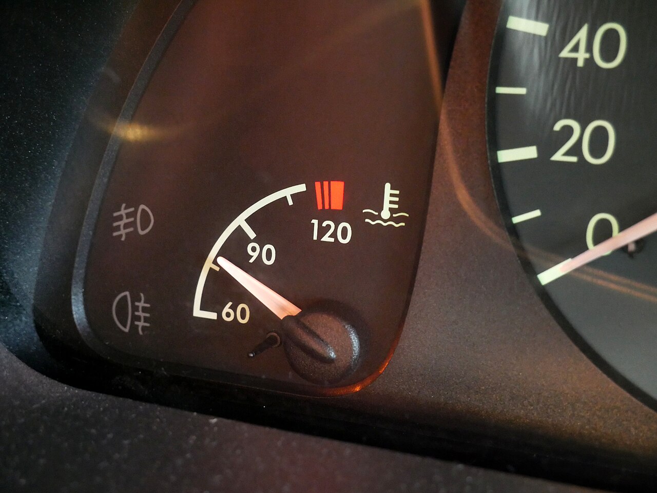 A coolant temperature gauge on a car dashboard