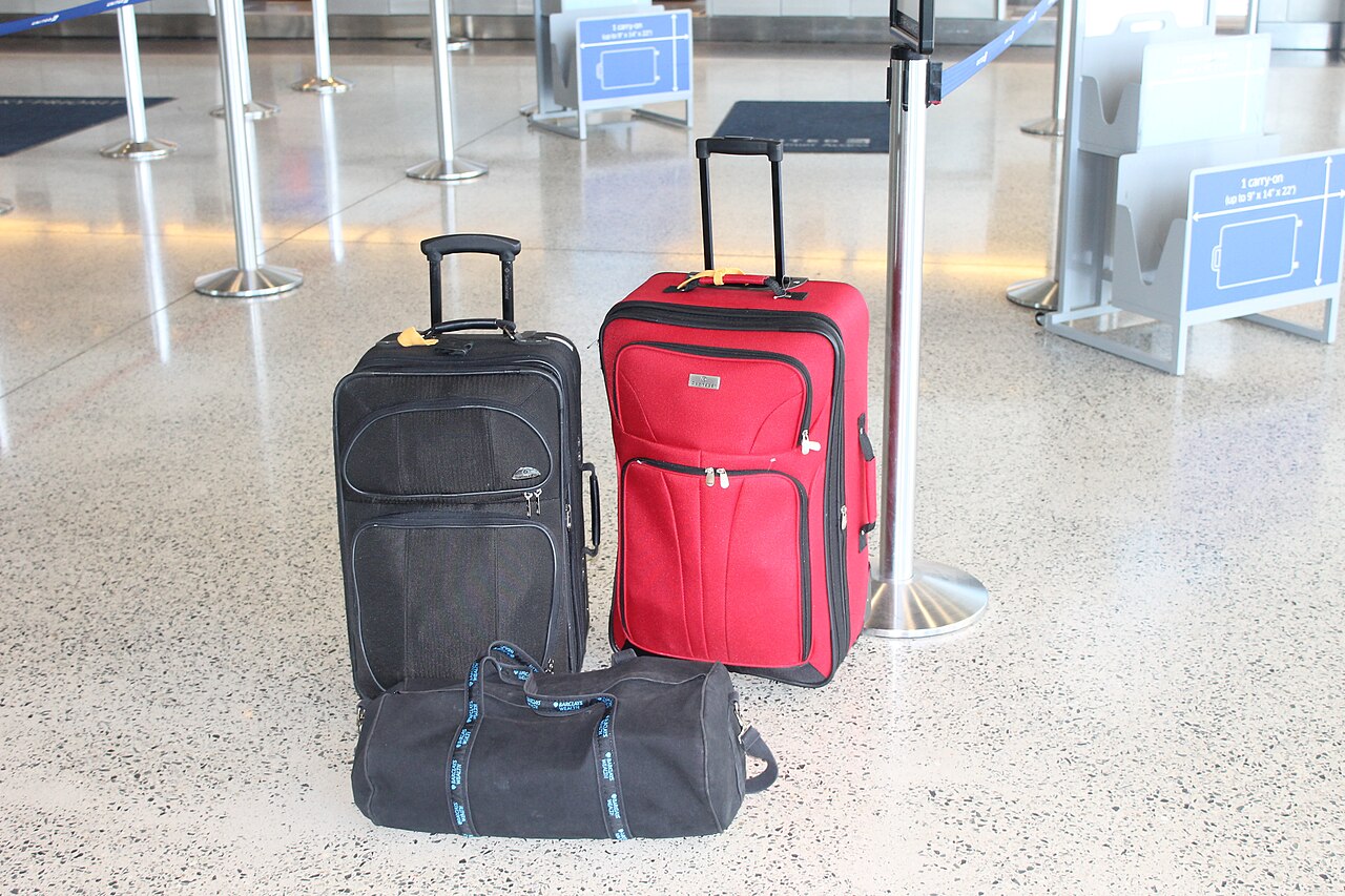 Luggage waiting to be loaded at an airport
