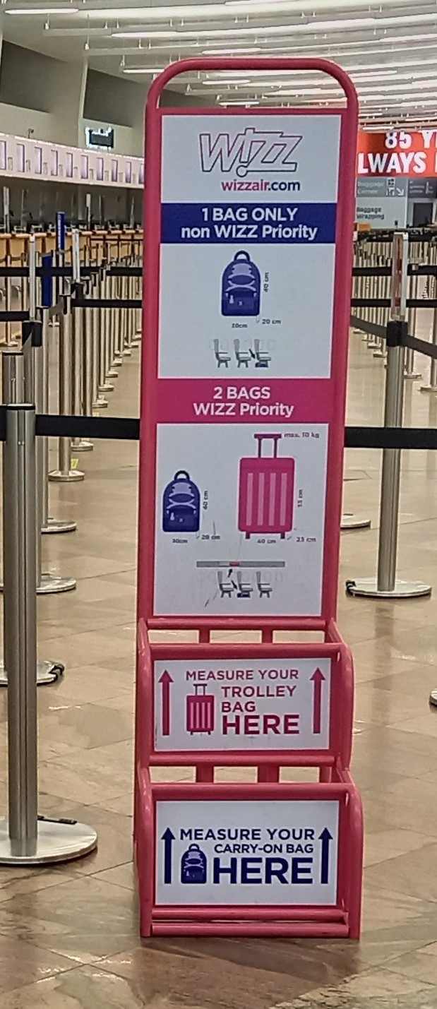 A baggage sizer at an airport gate